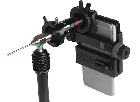 Clearwater CLEARSCOPE adapter clamping a rigid endoscope to a smartphone