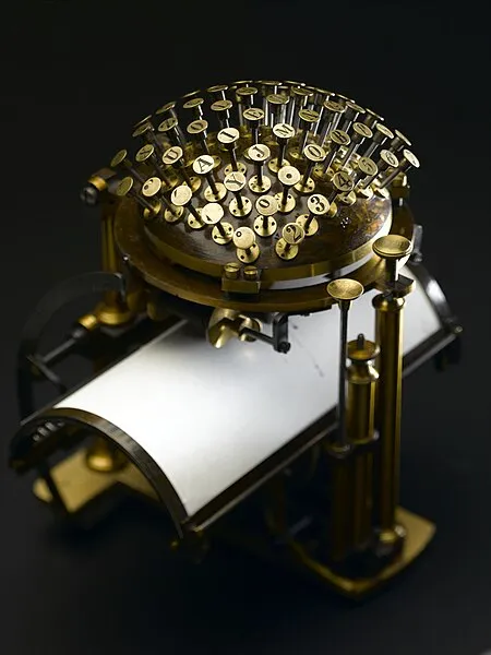 Brass Hansen Writing Ball typewriter with keys arranged on a hemisphere