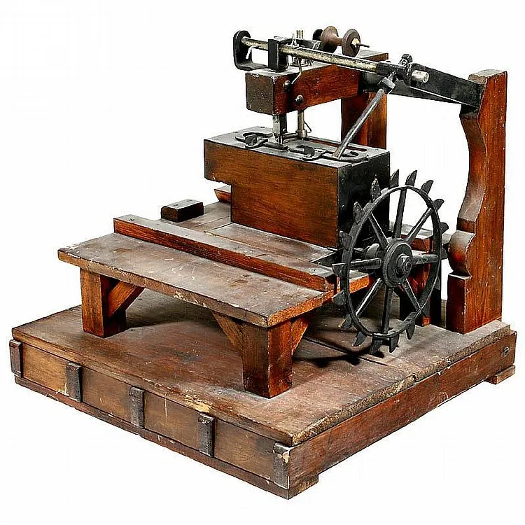 old wooden sewing machine with a hand crank and vintage parts