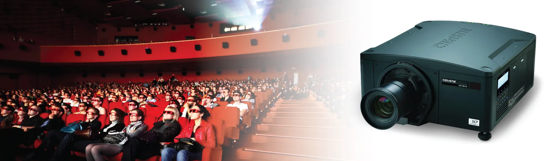 Audience in 3D glasses in a cinema beside a Christie digital projector