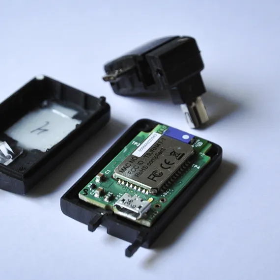 Opened blueSLR dongle showing its Bluetooth circuit board and micro-USB port