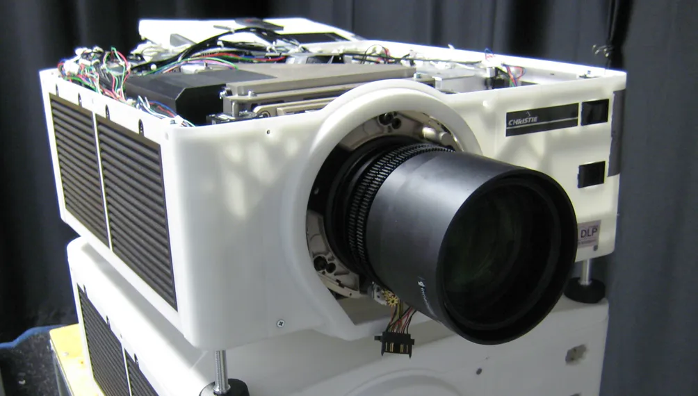 Christie DLP projector prototype with a white 3D-printed housing, exposed wiring and a large lens