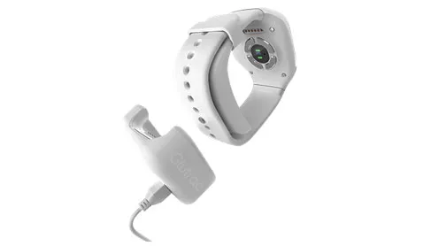 Glutrac white wrist-worn non-invasive glucose monitor with its charging dock