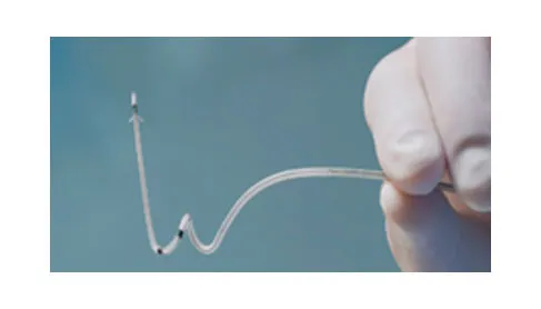 Gloved hand holding a thin curved cardiac lead, part of the HeartLogic heart failure diagnostic