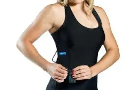 Woman wearing a black Hexoskin smart shirt with its sensor module at the waist