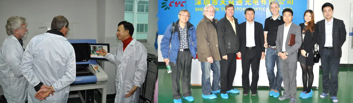 Design 1st engineers in lab coats inspecting equipment and posing with staff at a Chinese manufacturing partner