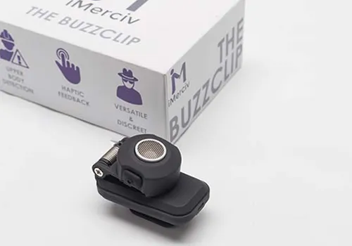 iMerciv BuzzClip wearable obstacle sensor clip in front of its packaging