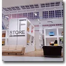Small photo of a lit retail store interior with a Store sign