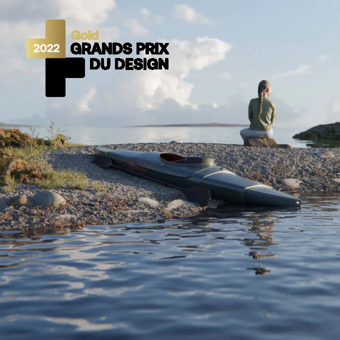 Telescoping Kayak on a rocky shore with its 2022 Grands Prix du Design gold badge