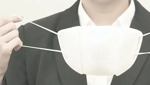 Donut Robotics C-Mask held up to show its speaker grille