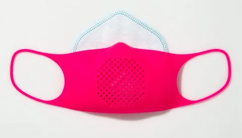 Pink silicone Reusable Face Mask 2.0 over a white filter insert