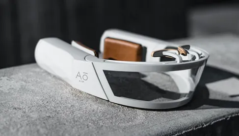 AO Air Atmos white face mask resting on a concrete ledge