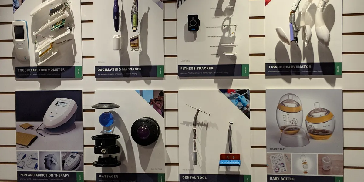 Wall of Design 1st project boards with exploded views of a thermometer, massager, tracker and baby bottle
