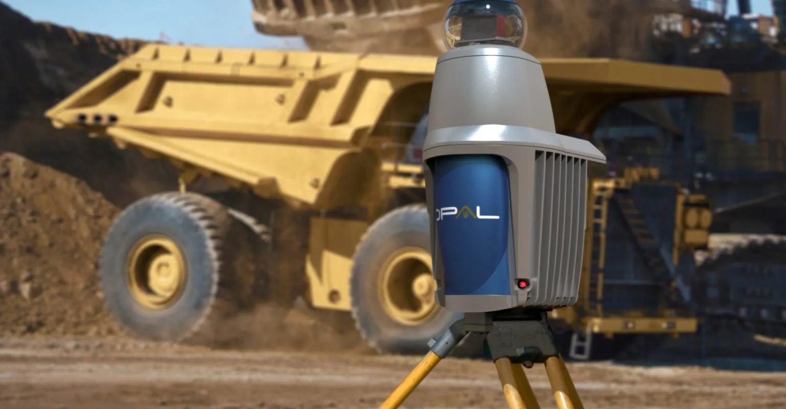 Komatsu MC51 mining machine with a rotating cutter head on a yard outside a factory