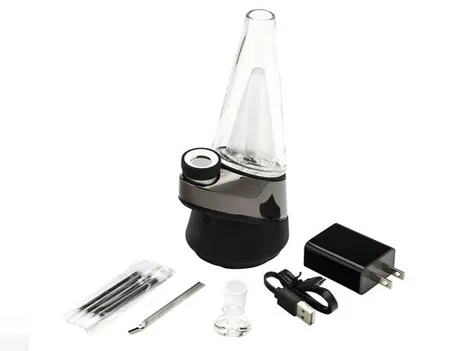 Puffco Peak vaporizer with glass top beside its charger, cable, tools and carb cap
