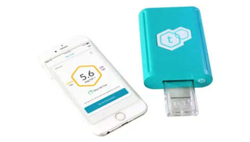 tCheck teal cannabis potency tester with sample tray and companion app showing a reading