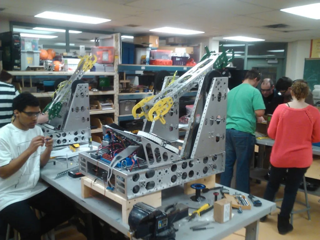 Astechz Team 2994 students building their FIRST Robotics robot in the shop