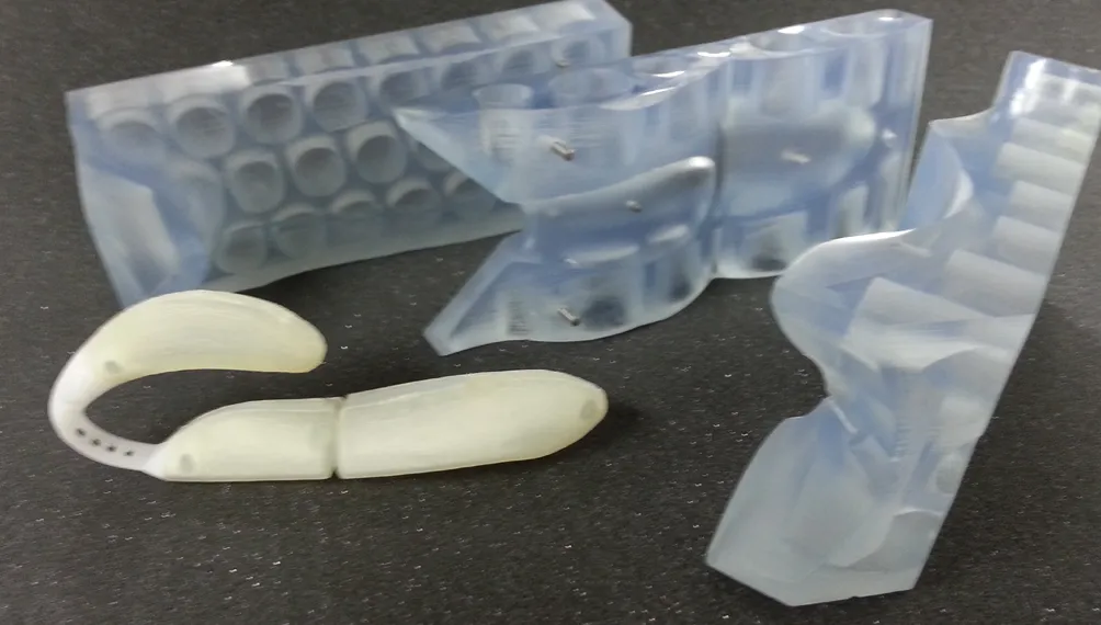 SLA-printed moulds and a cast prototype of the Blue Dreams Feather personal massager