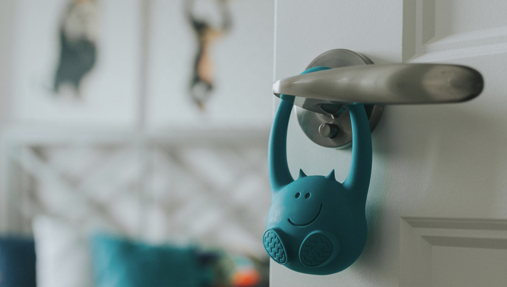 toddler monitor feature image; toddler monitor device hangs off doorknob