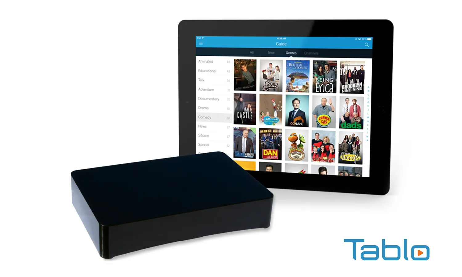 Tablo over-the-air DVR box in front of a tablet showing its programme guide
