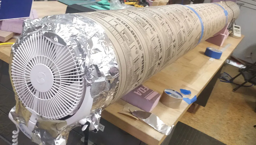 Molecule bench-model test rig with a fan taped to a foil-wrapped cardboard tube