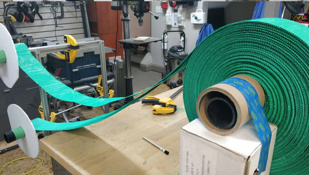 Green desiccant tape being wound onto a roll to build the Molecule sorbent rotor