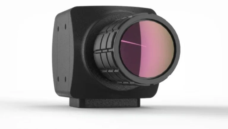 CAD render of a black Lumenera camera enclosure with a ridged lens barrel
