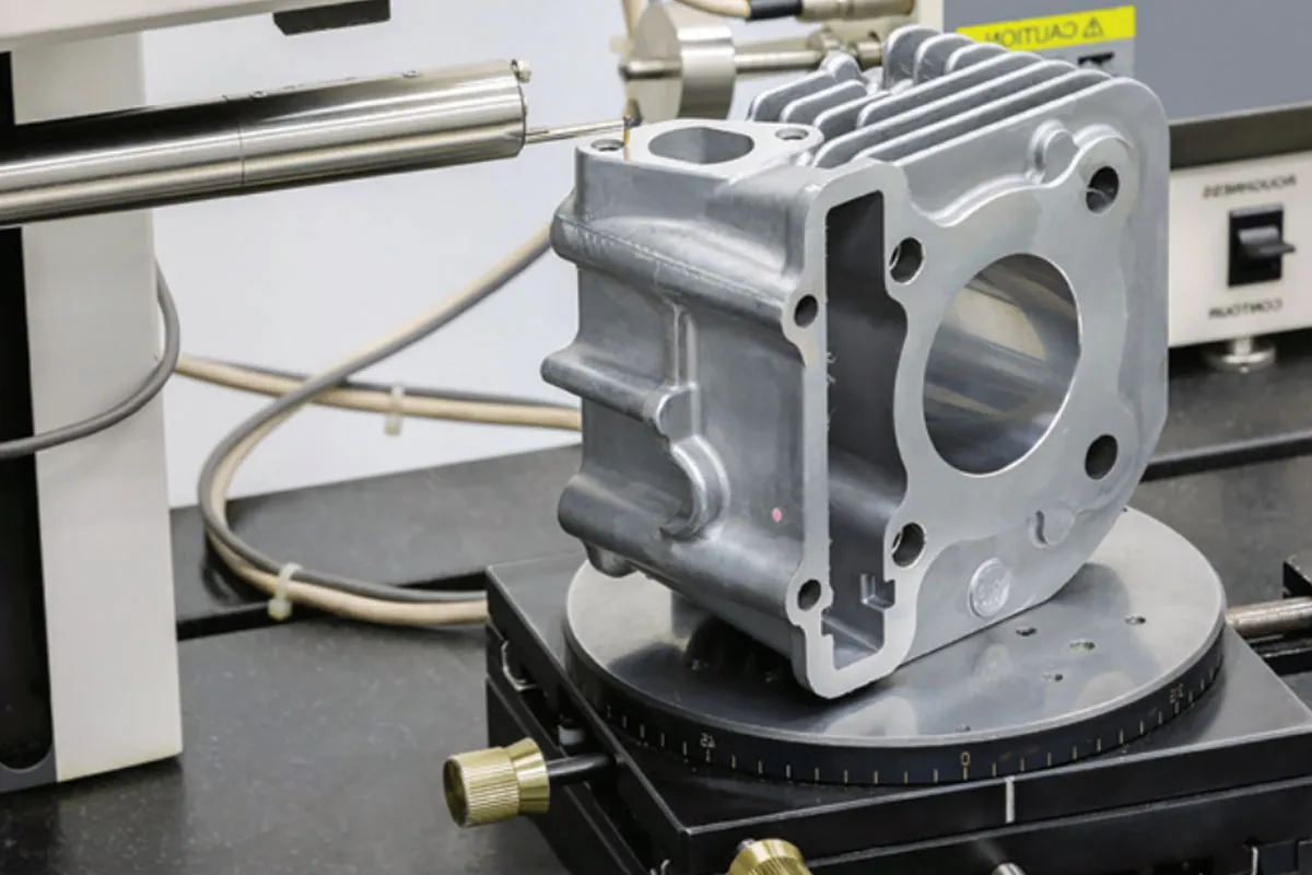 Machined metal casting being inspected on a coordinate measuring machine