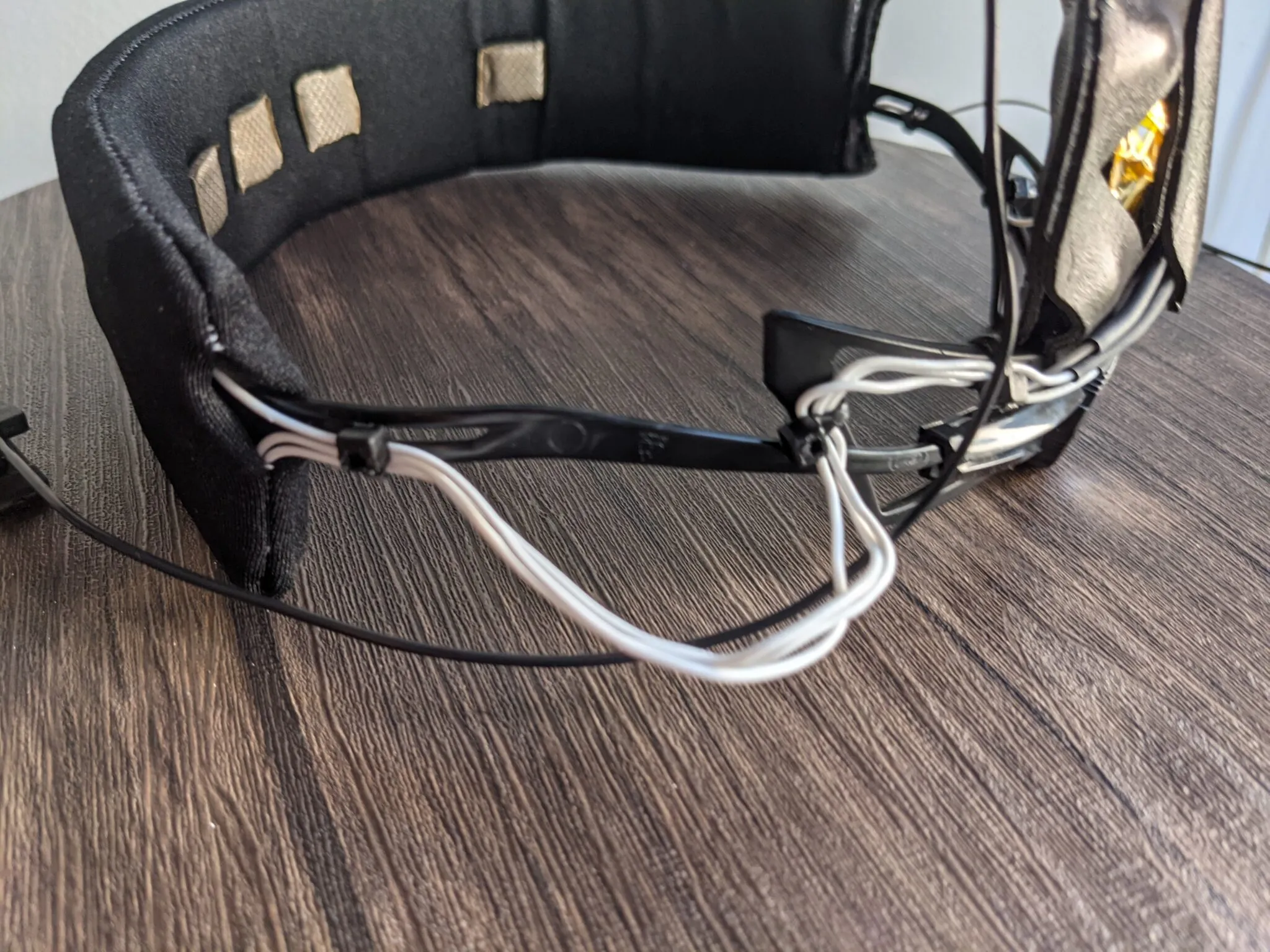 Inside of the Neurovine headband prototype showing fabric electrodes and wiring routed along the band