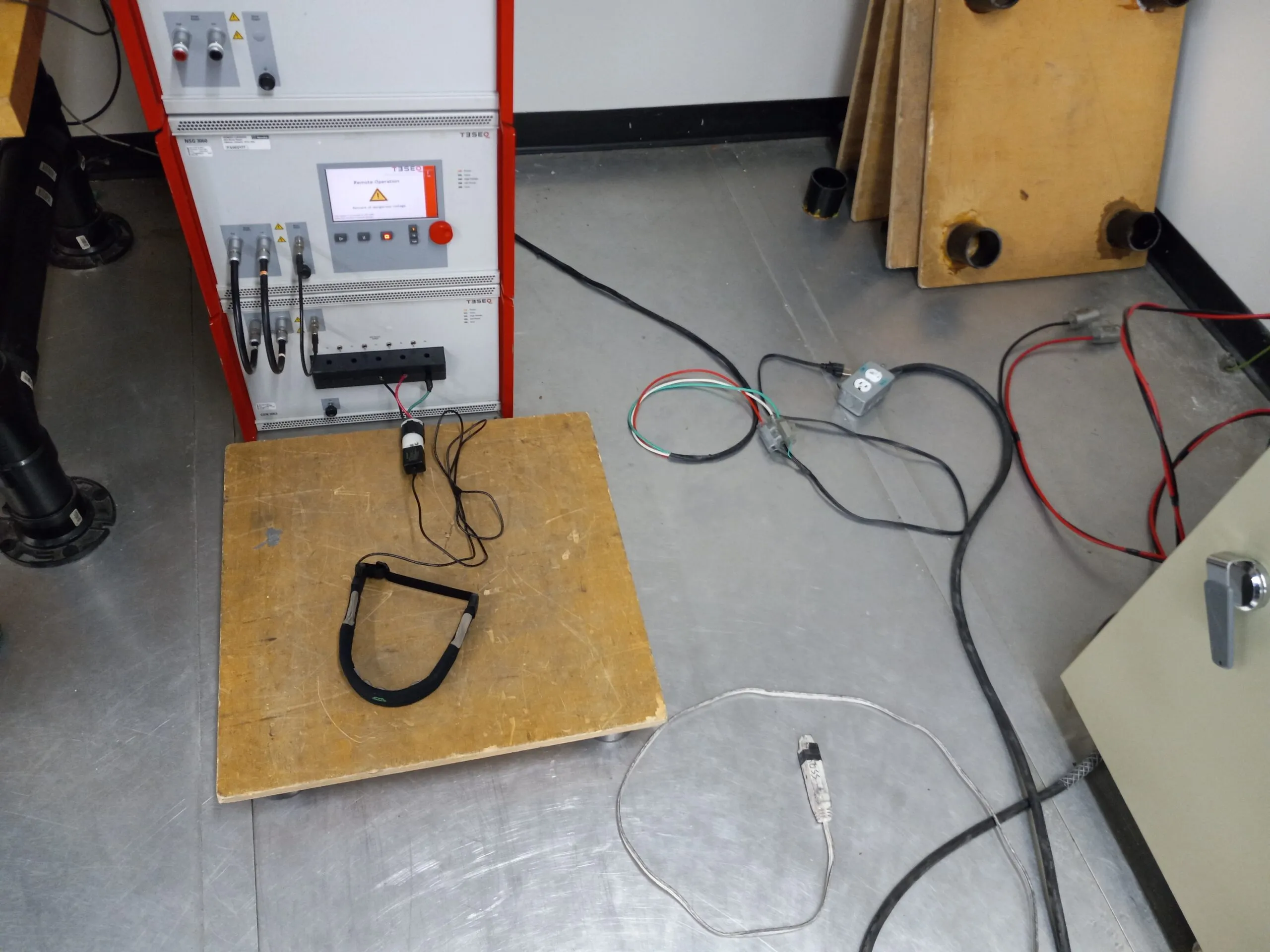 Neurovine headband on a test table wired to an EMC test generator at the Nemko lab