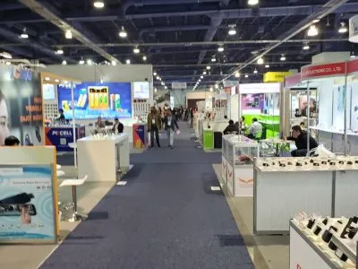Aisle of small electronics and accessory vendor booths at CES 2020
