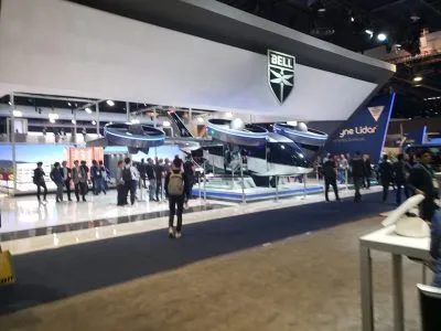 Bell air taxi aircraft suspended above the Bell booth at CES 2020