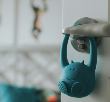 toddler monitor feature image; toddler monitor device hangs off doorknob